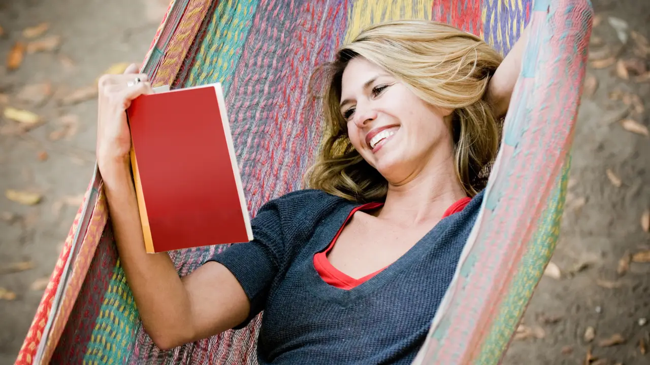 Woman reading in a hammock