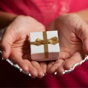 Woman’s hands with a gift