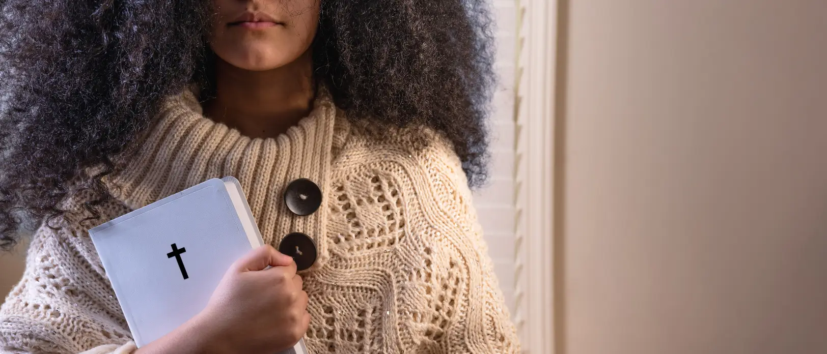 Young Woman holding a Bible