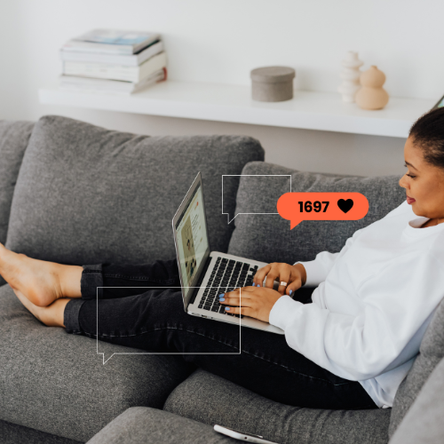 Woman sitting on her couch looking at social media